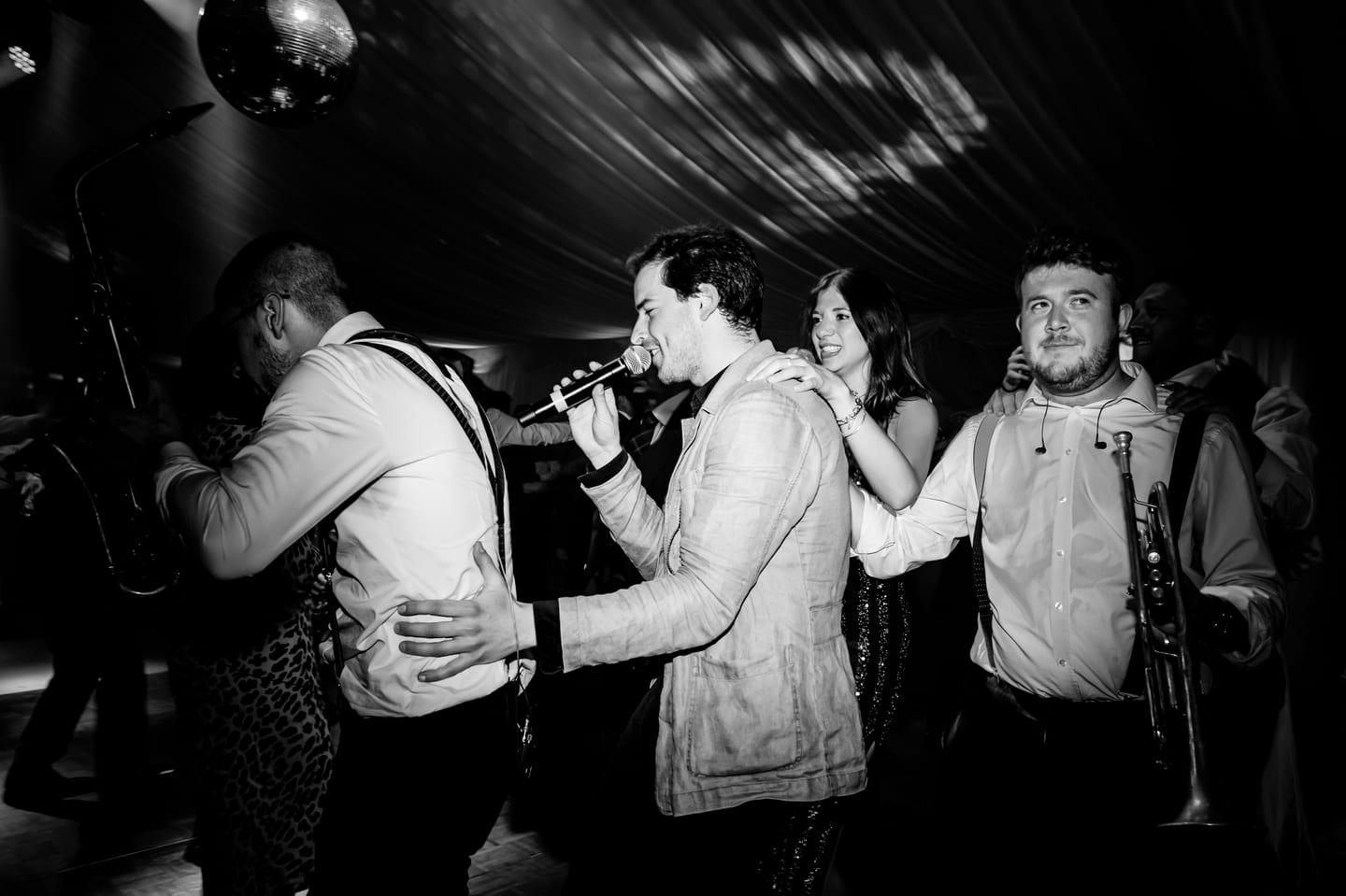 A saxophonist out in the crowd