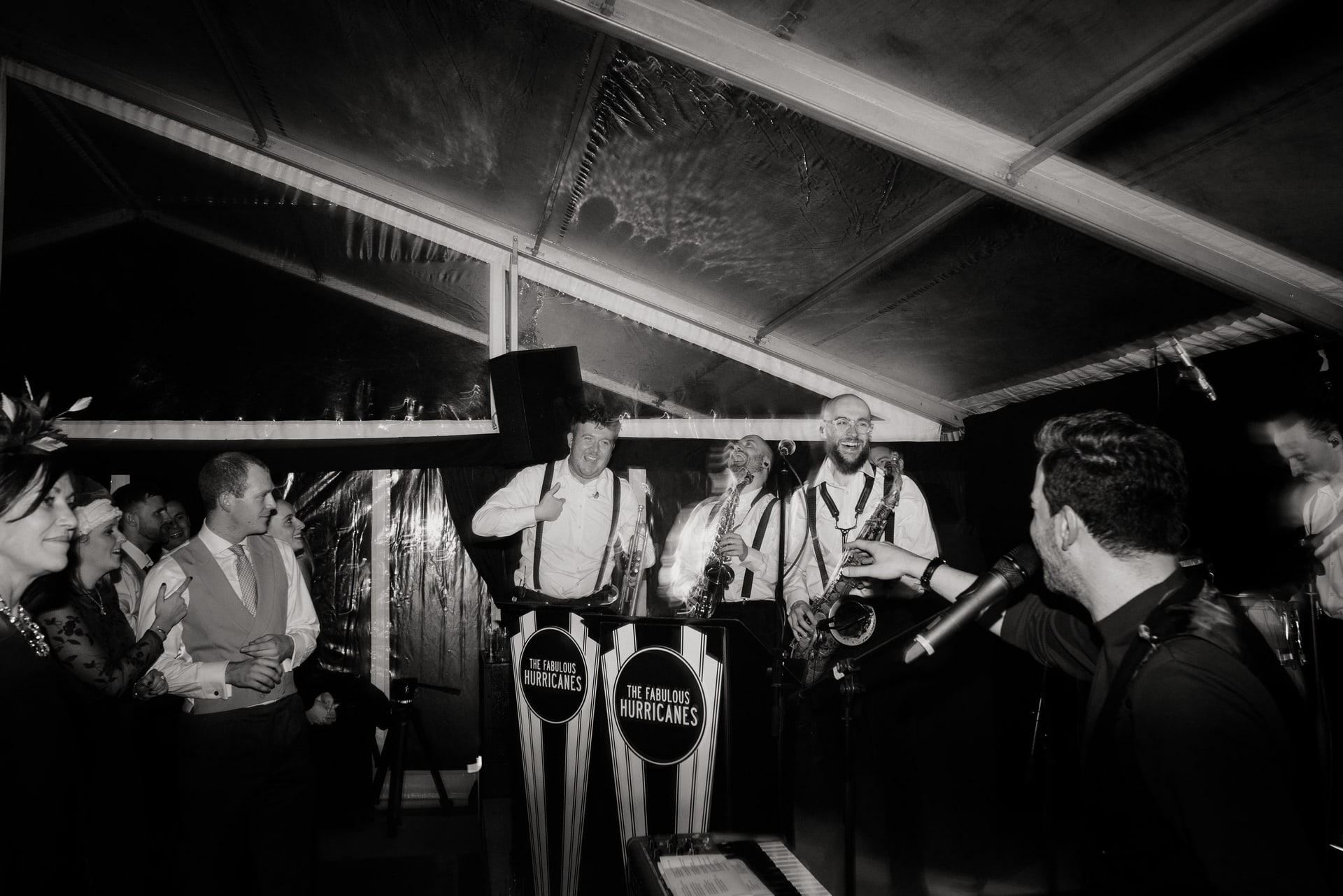 The band playing in a marquee, in black and white